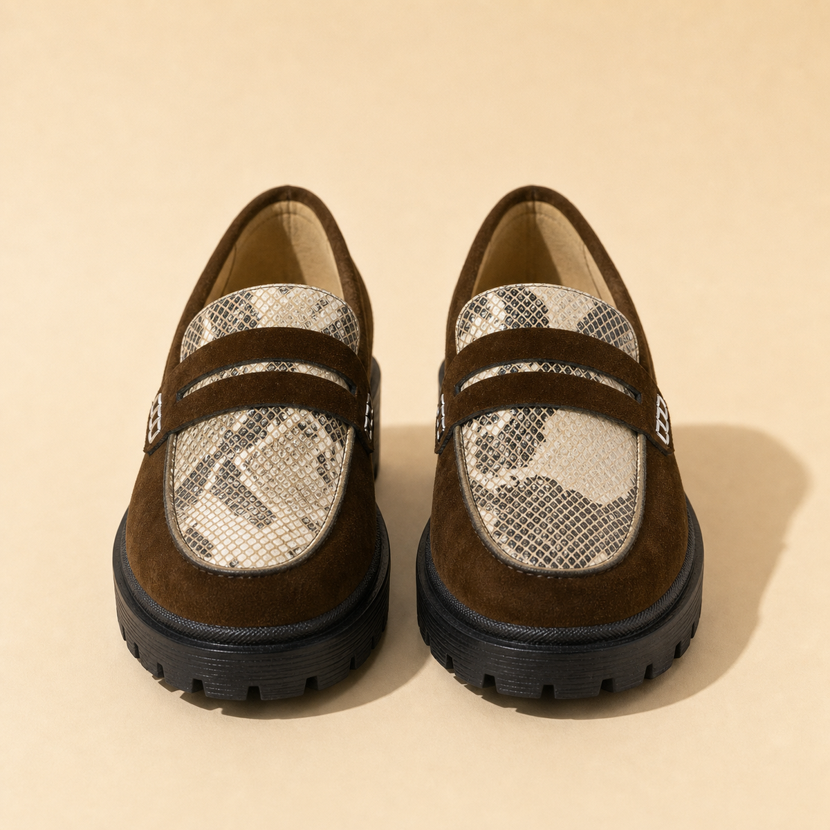 Front view of a pair of Walkie Walkie Serpentine brown velvet loafers with snake patent aprons